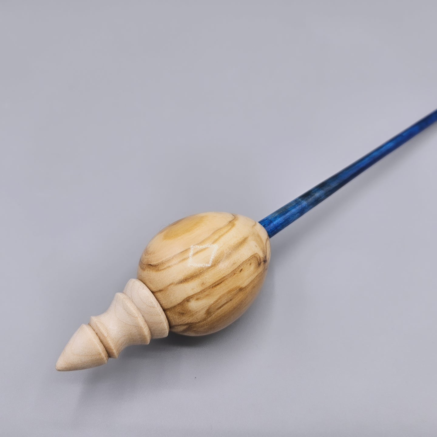 Olive wood egg spindle with curly maple dyed shaft