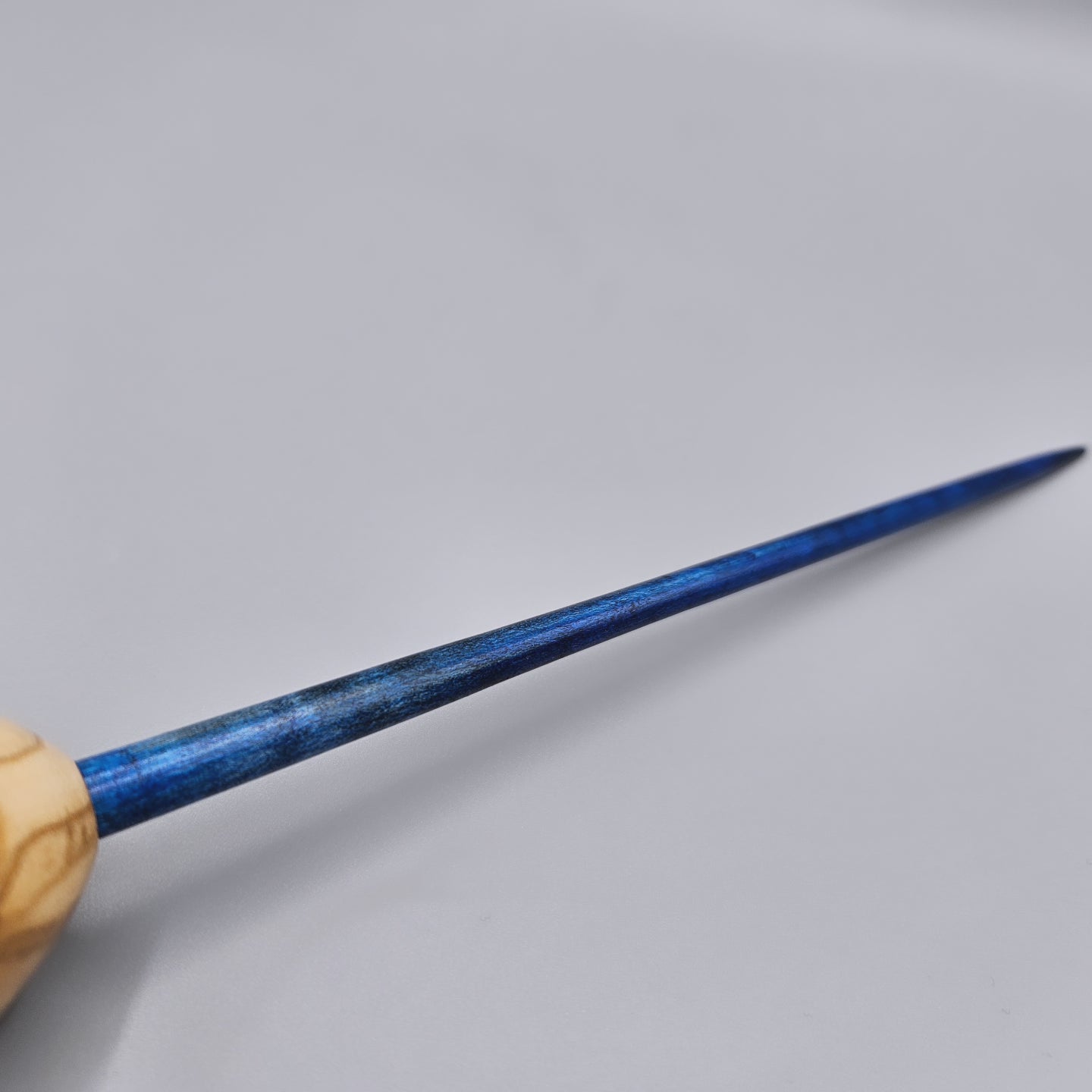 Olive wood egg spindle with curly maple dyed shaft